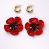 Tropical red flower statement earrings close-up