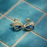 Blue crystal swan stud earrings gold plated