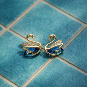 Blue crystal swan stud earrings gold plated